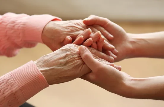 depositphotos 63463595 stock photo old and young holding hands